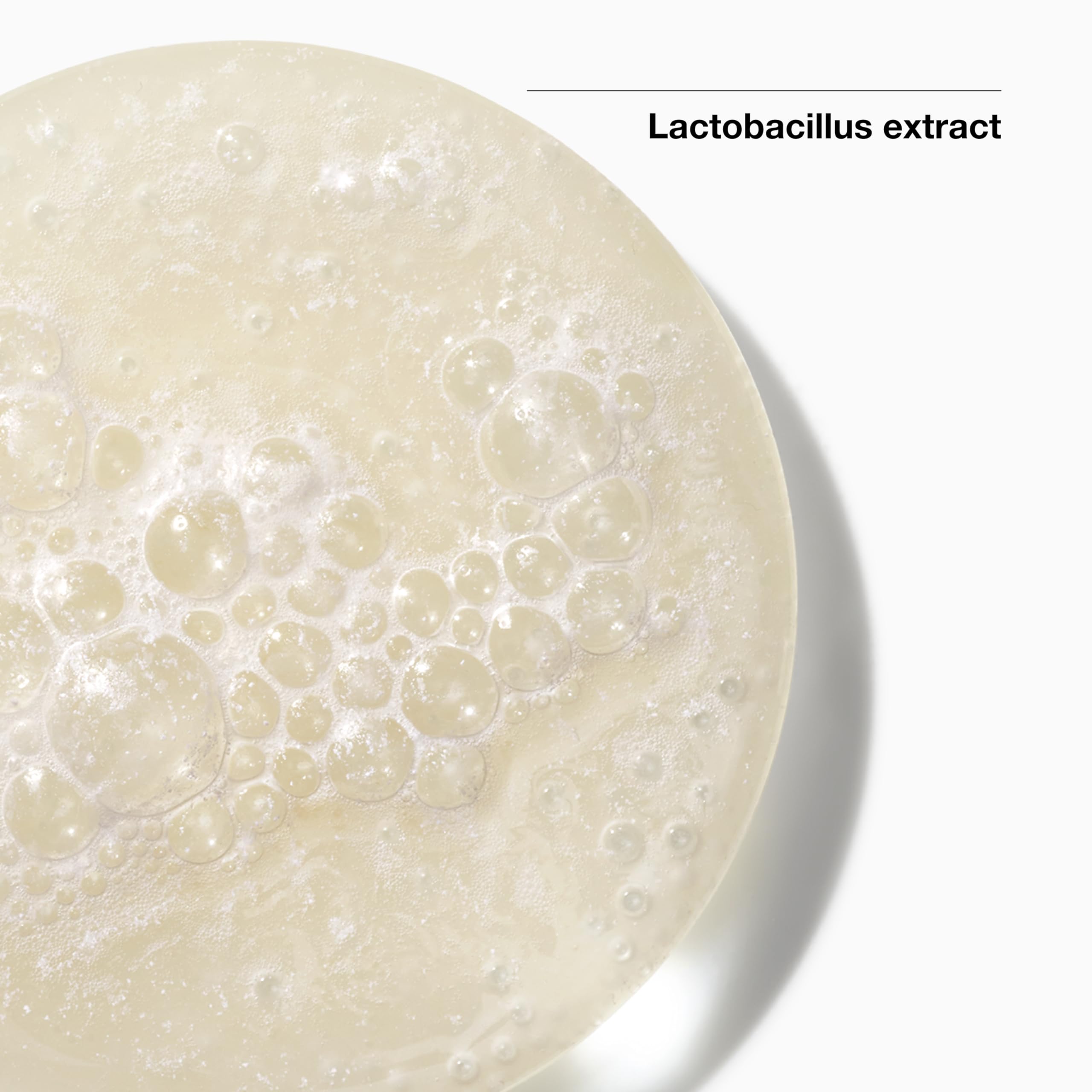 Clinique jar open top view showing pale cream and easy scoop for daily use benefit