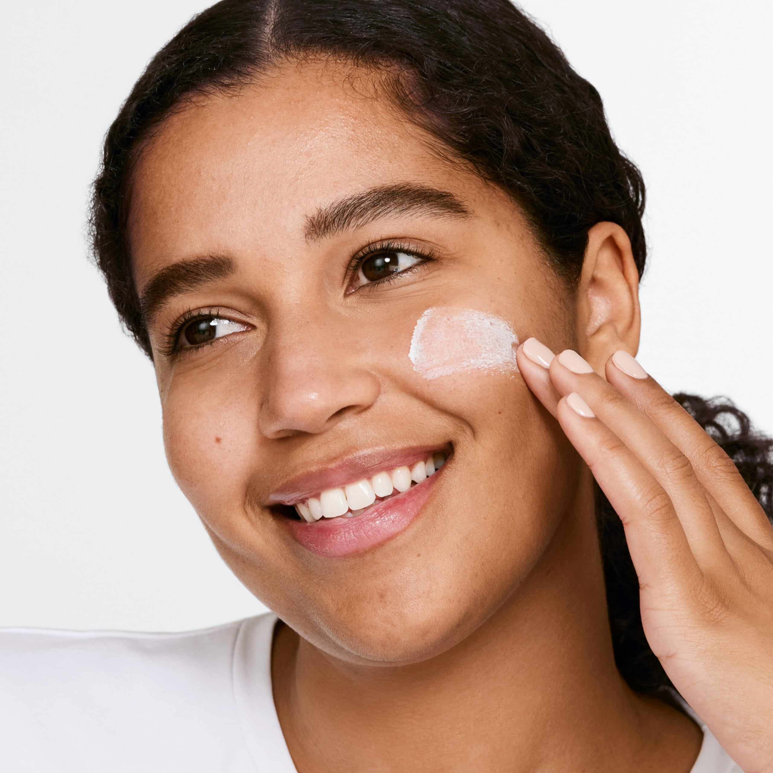Clinique scrub on hand being applied showing lightweight rinse-off benefit