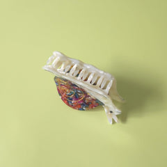 Clip Sugar scale photo beside fingers showing compact size and portability