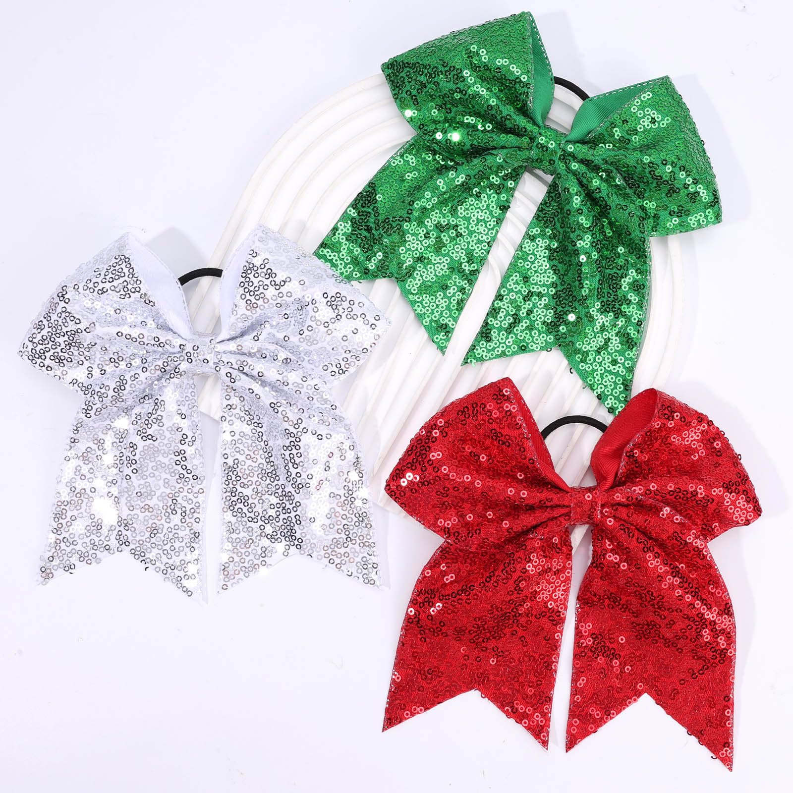 CN group of cheerleaders wearing bows illustrating team uniform sparkle