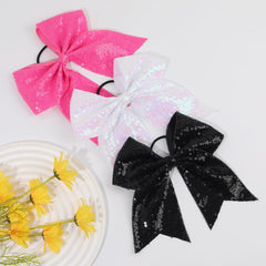 CN lifestyle cheerleader wearing bow demonstrating performance-ready look