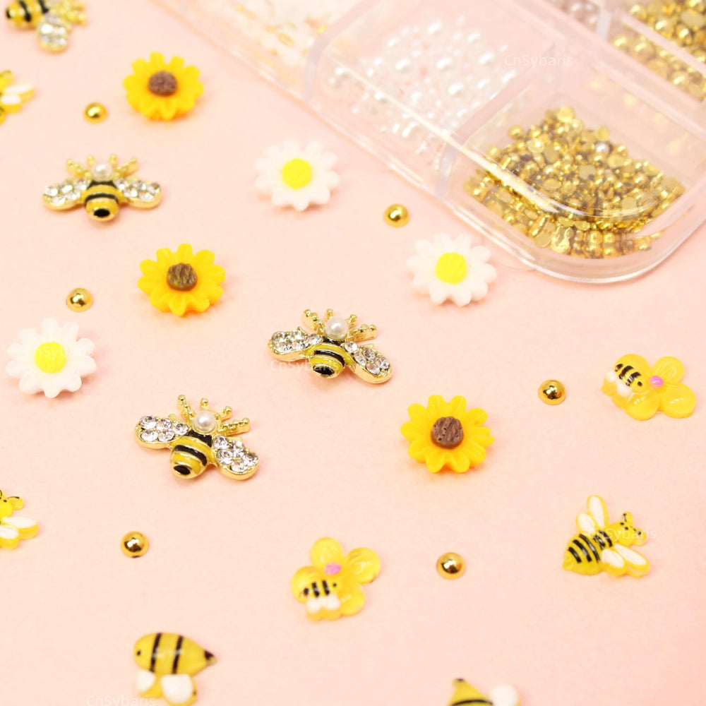 CnSybaris lifestyle image of spring manicure featuring bee and daisy charms for seasonal style