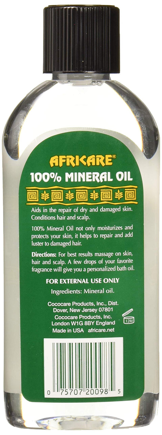 COCOCARE Africare oil drop on skin demonstrating hydration and shine benefits