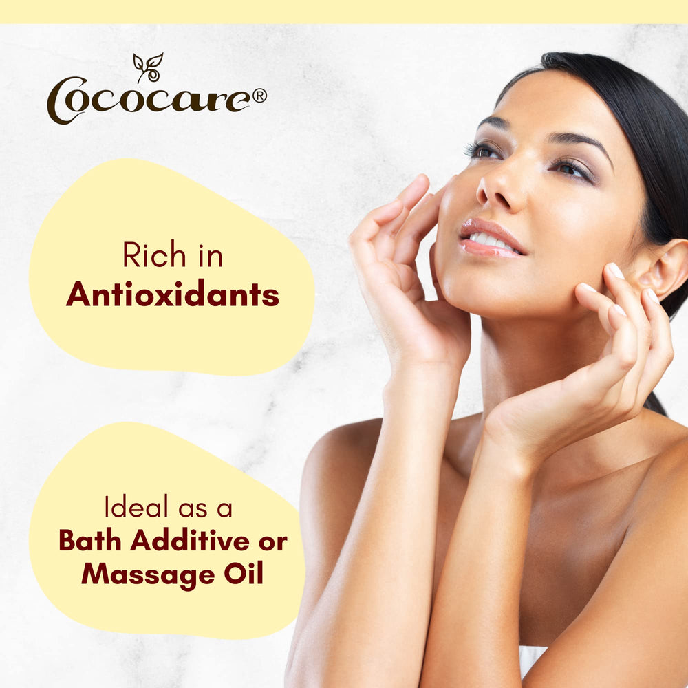 COCOCARE pouring oil into hand demonstrating easy spread and smooth glide