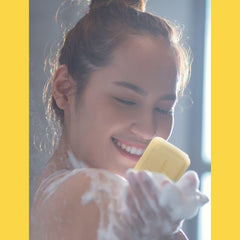 COCOCARE body shower use showing full-body cleanse and softening benefit