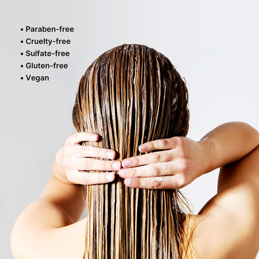 COLOR WOW conditioner texture on hand illustrating lightweight, non-greasy slip benefit