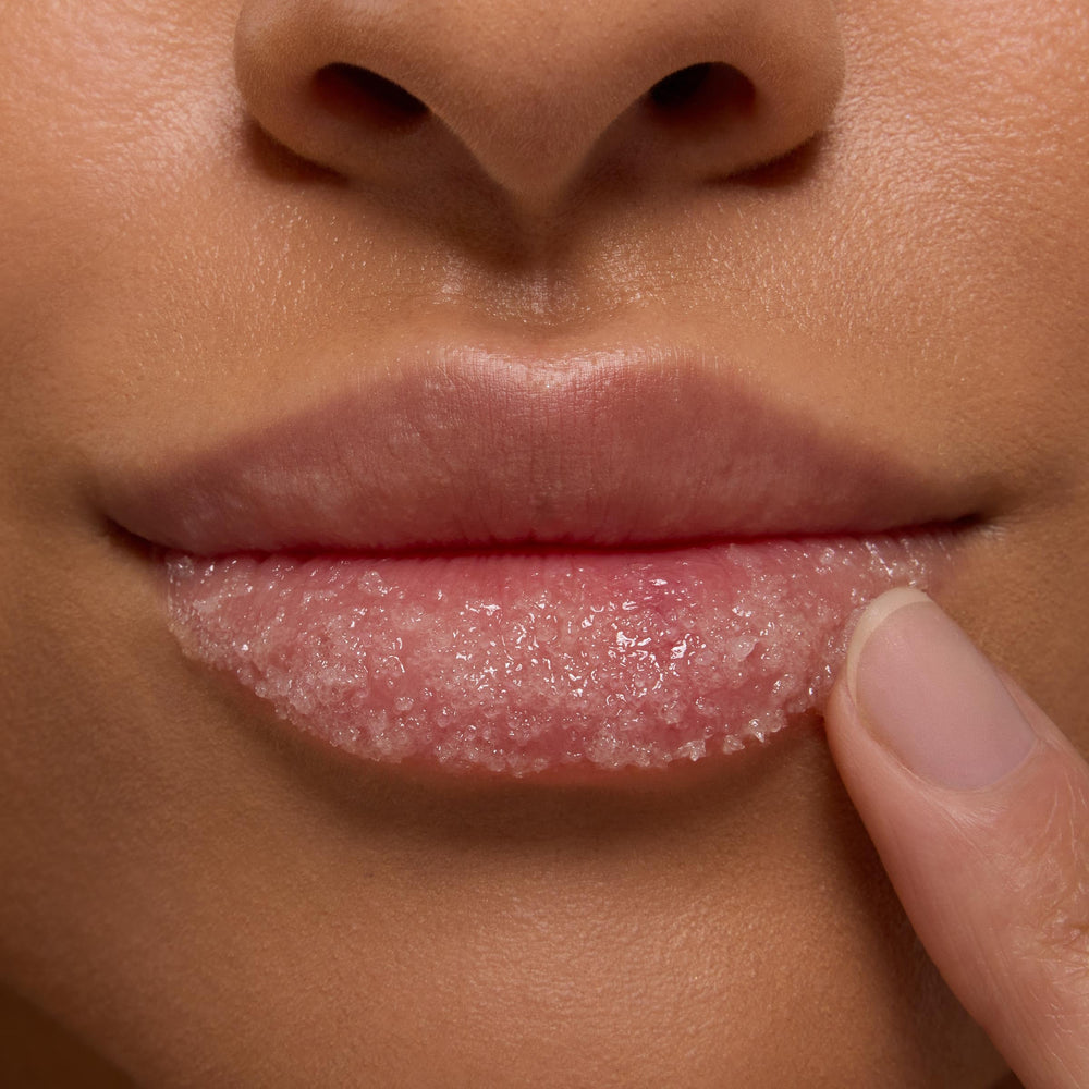 ColourPop scrub being applied to lips demonstrating soft buffing benefit