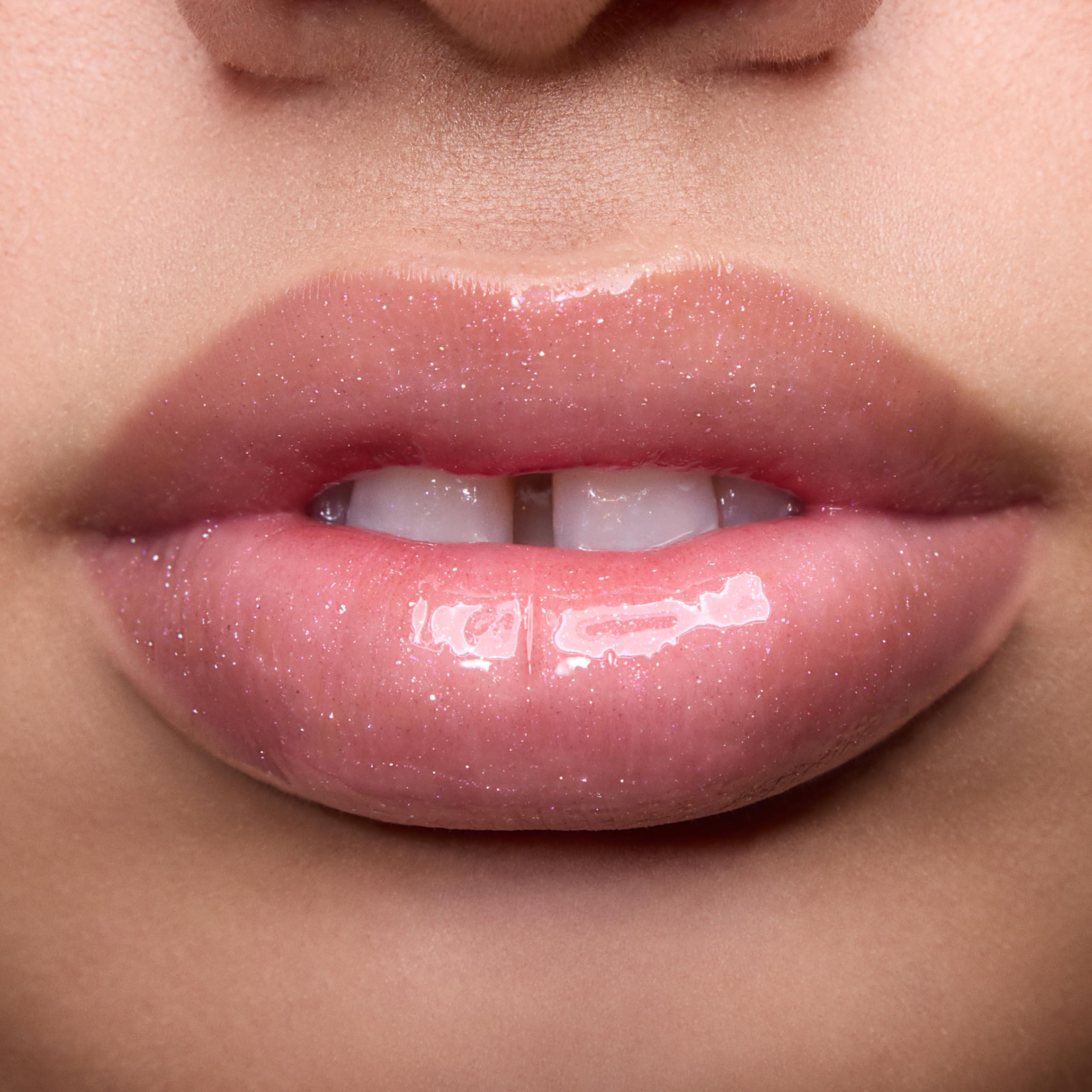ColourPop applied on lips demonstrating pearlescent shimmer and plump look benefit