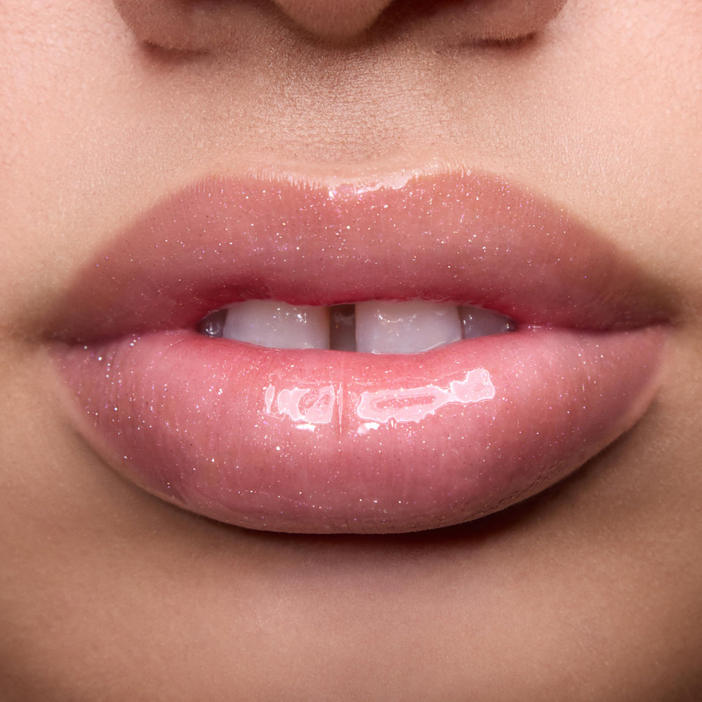 ColourPop applied on lips demonstrating pearlescent shimmer and plump look benefit