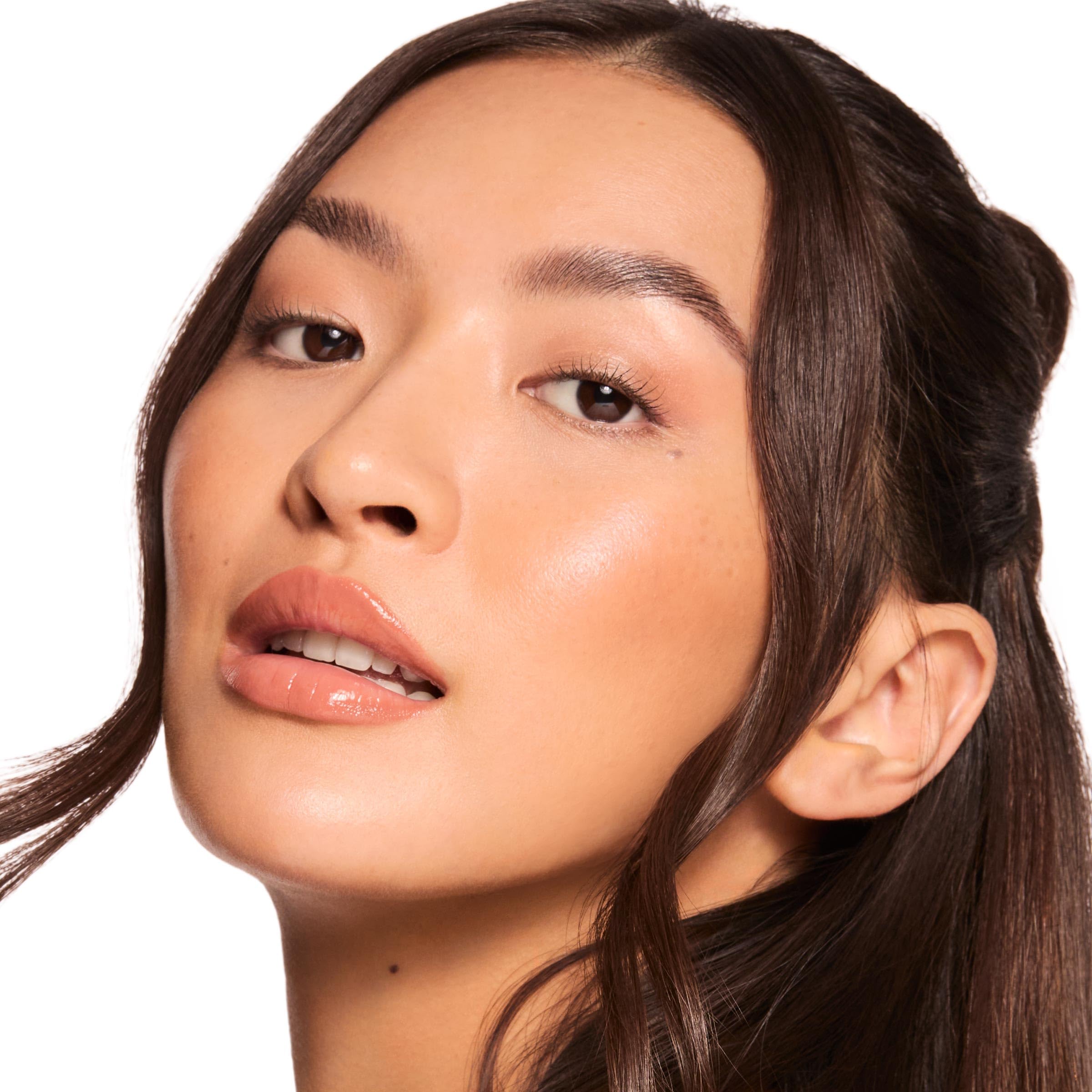 ColourPop Caramel Latte applied on lips showing warm brown tint benefit: subtle color and shine