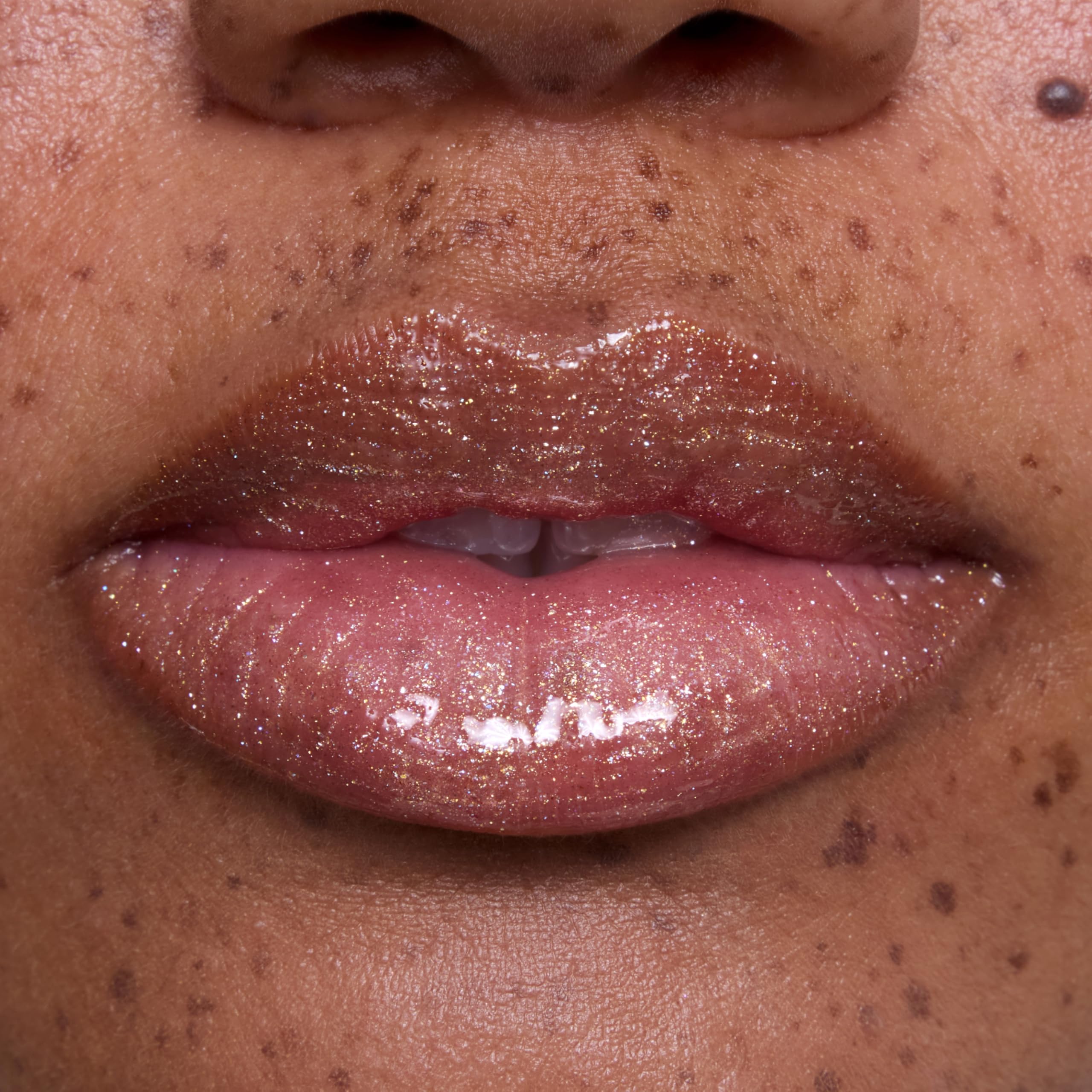 ColourPop on-model lip swatch showing pearly gold shine for flattering radiance