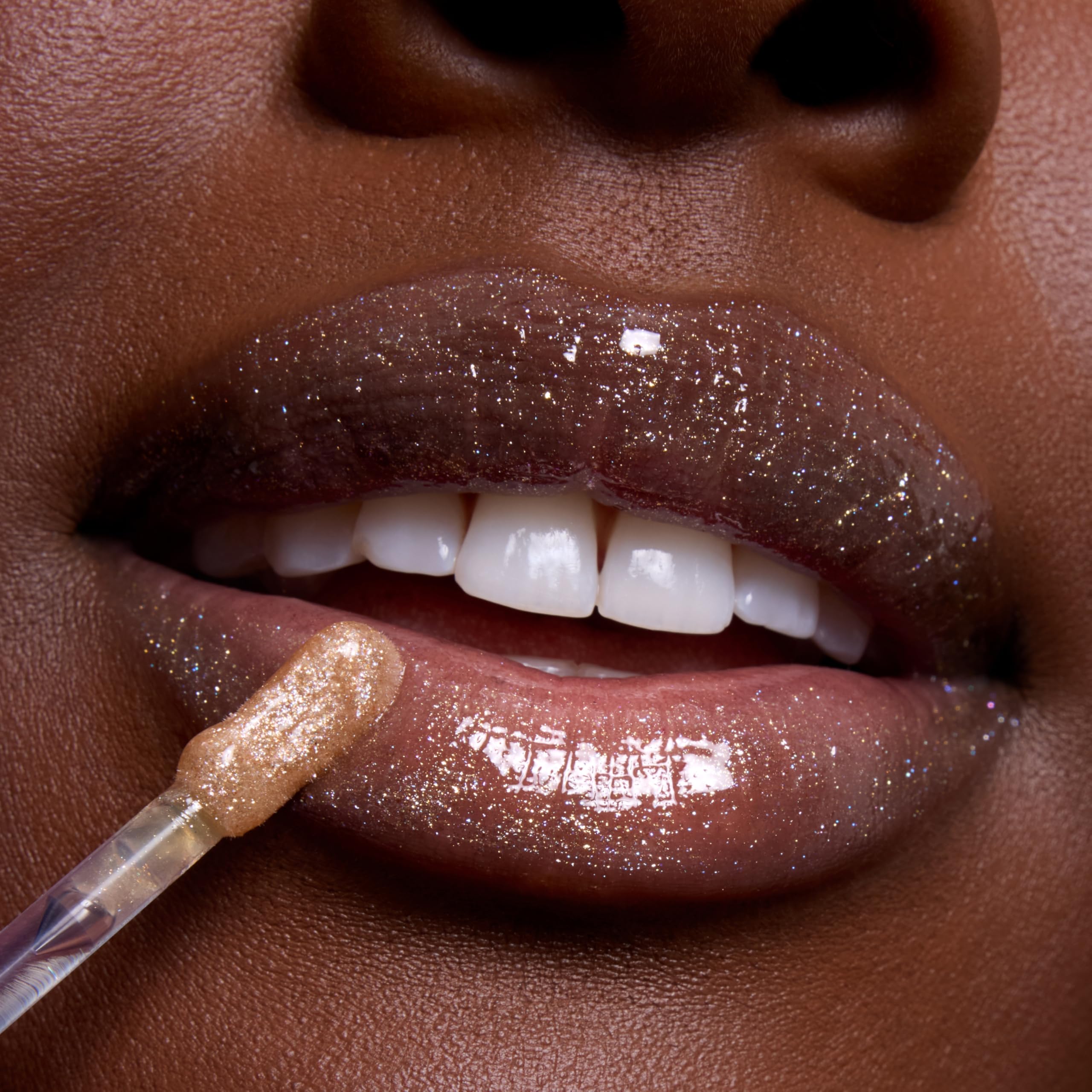 ColourPop layered over lipstick showing enhanced color and luminous dimension