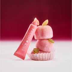 ColourPop Fresh Kiss in a peach-themed lifestyle scene showing scent suggestion benefit: inviting fragrance