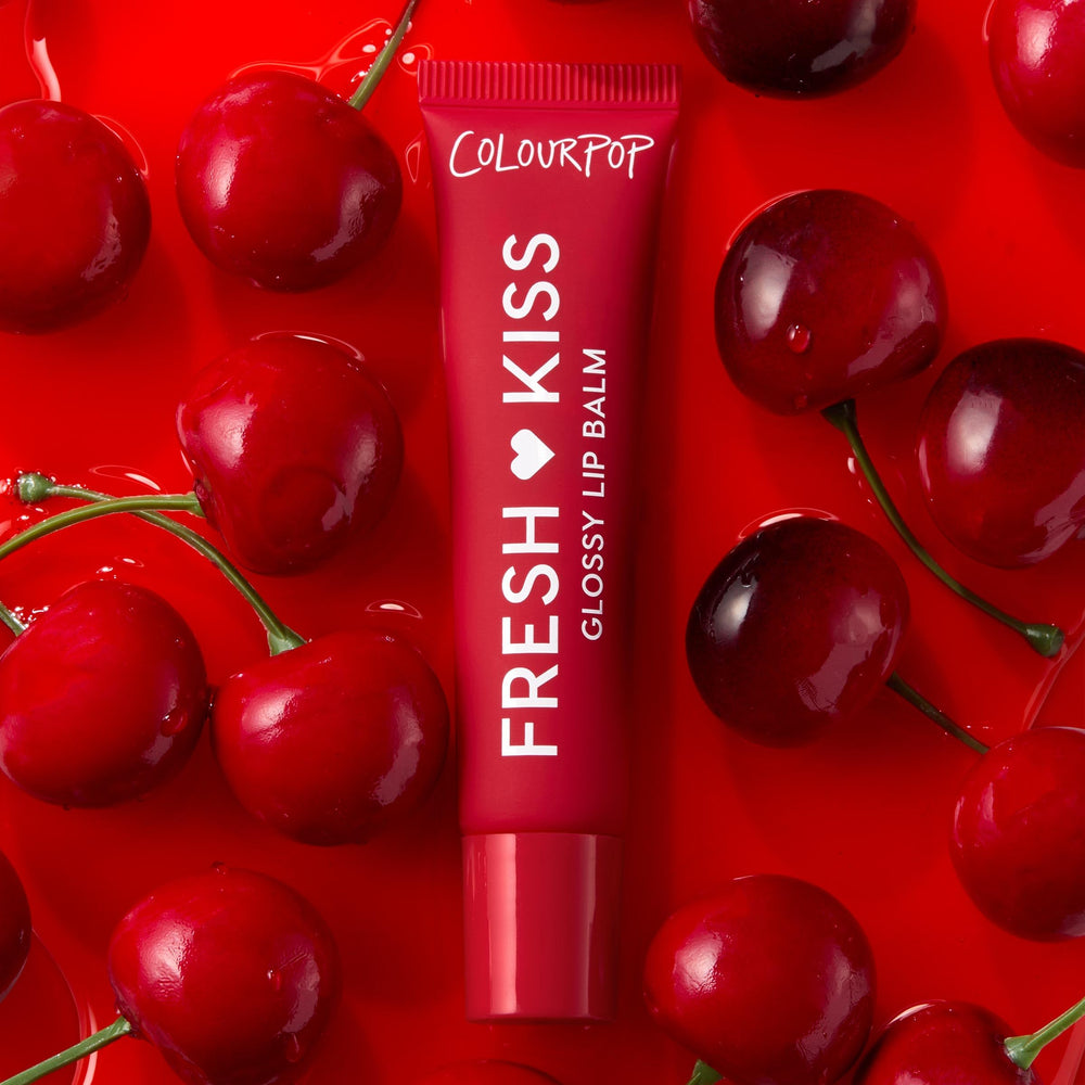 ColourPop Fresh Kiss open tube angle showing applicator and silky balm texture