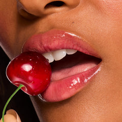 ColourPop Fresh Kiss swiped on lips showing sheer cherry tint and shine