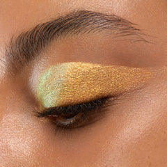 Close-up of ColourPop Glaze metallic shimmer reflecting light for dramatic eye dimension
