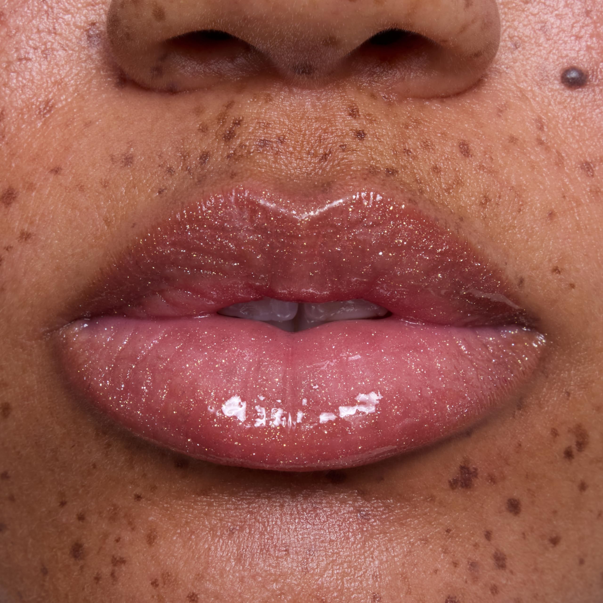 ColourPop gloss on model lips in lifestyle shot enhancing natural color benefit