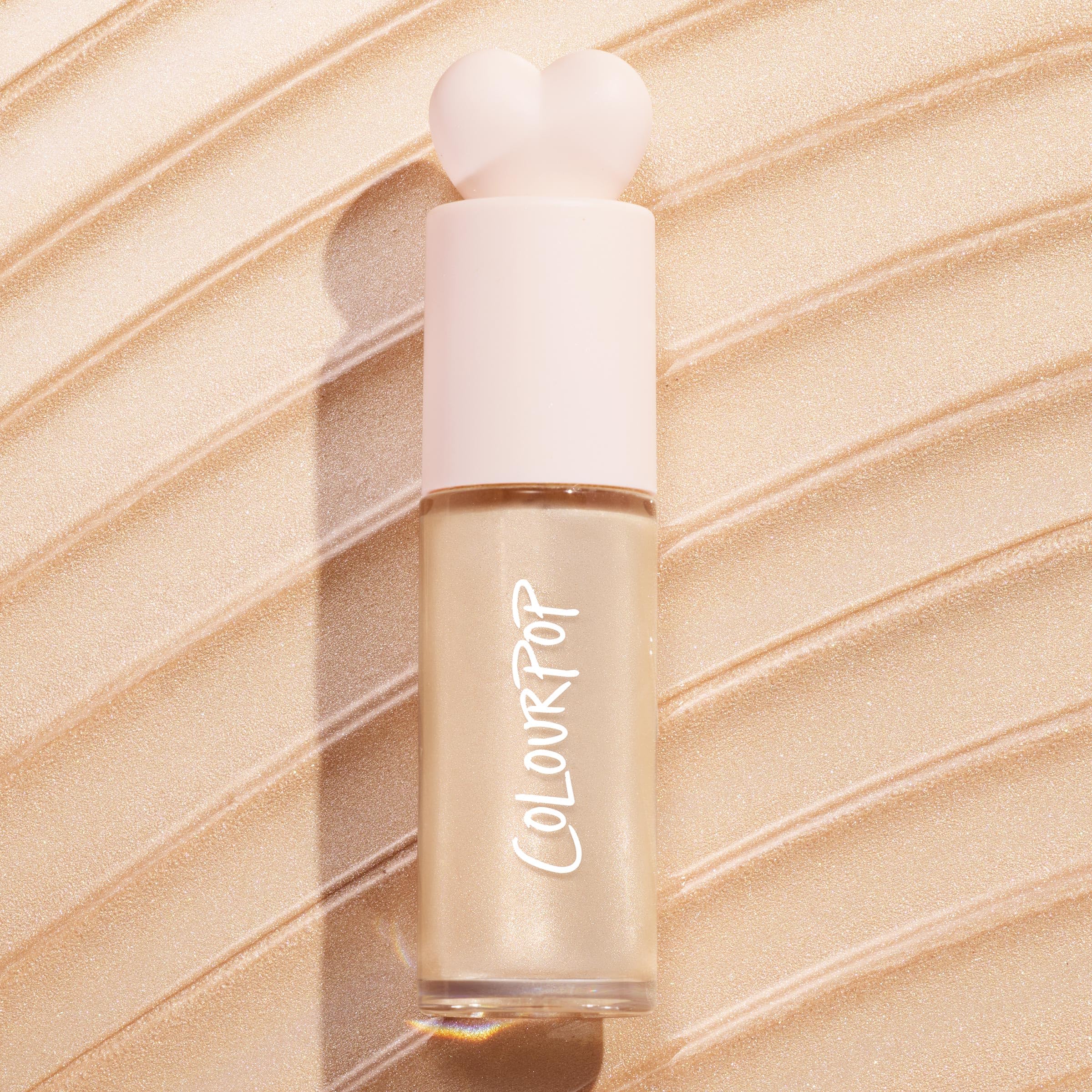 ColourPop Hi-Lite bottle beside lotion showing size and dilution option