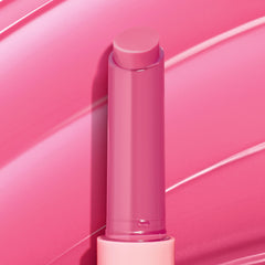 ColourPop in a purse by mirror showing easy on-the-go touch-up benefit
