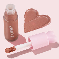 ColourPop bottle on bathroom counter with skincare items showing everyday routine fit benefit