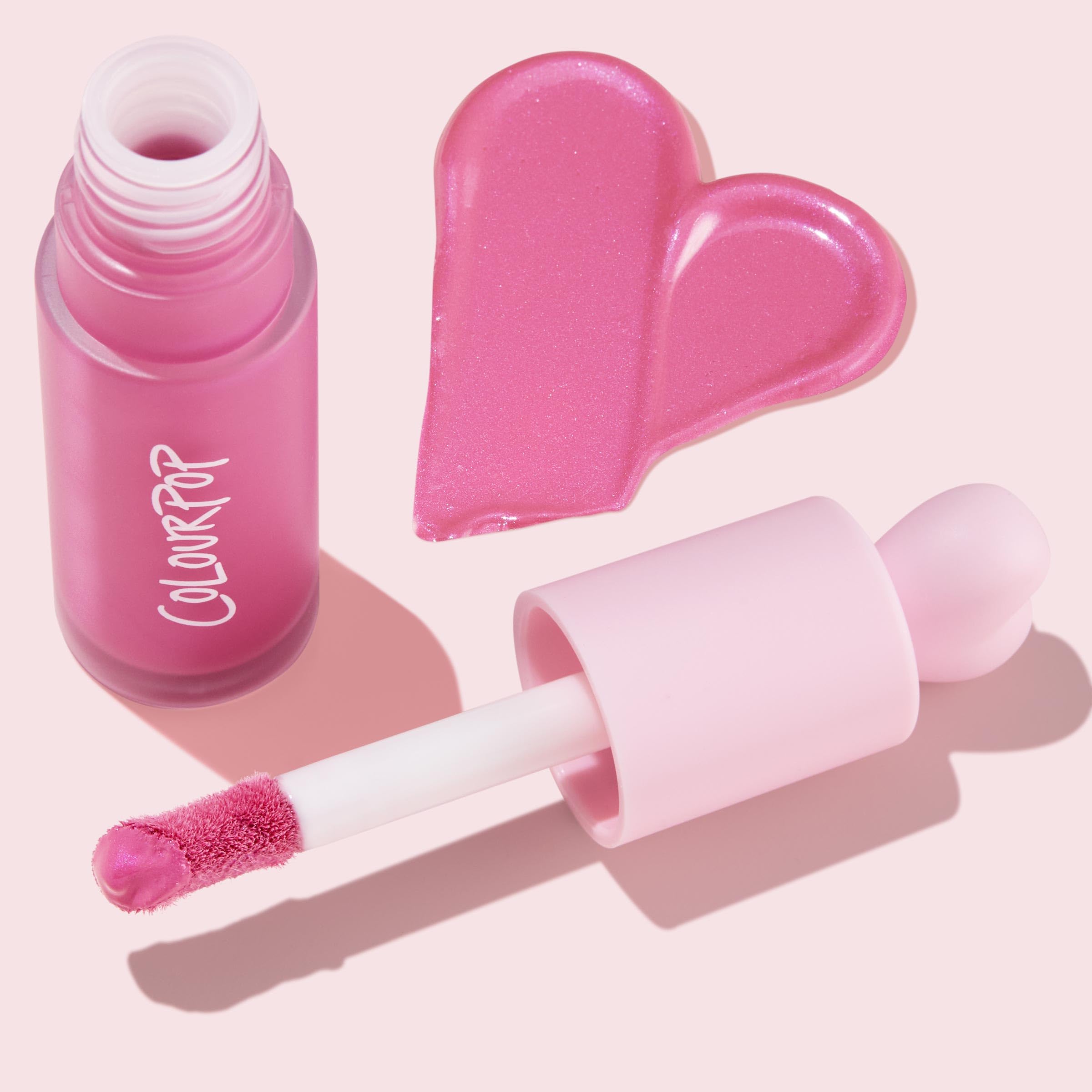 ColourPop on bathroom vanity with mirror showing everyday makeup routine