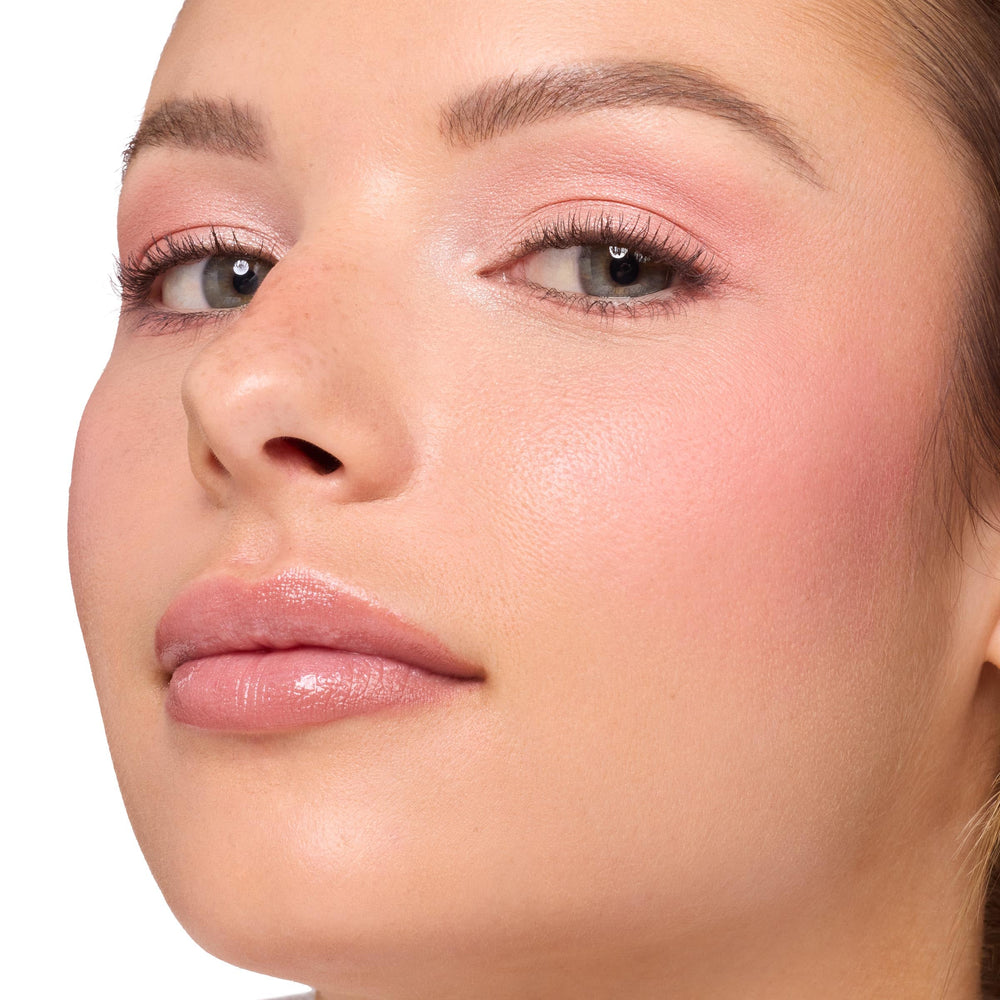 ColourPop balm applied on lips showing buildable color and plumping effect