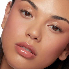 ColourPop So Juicy lip swatch on model demonstrating sheer tint and shine