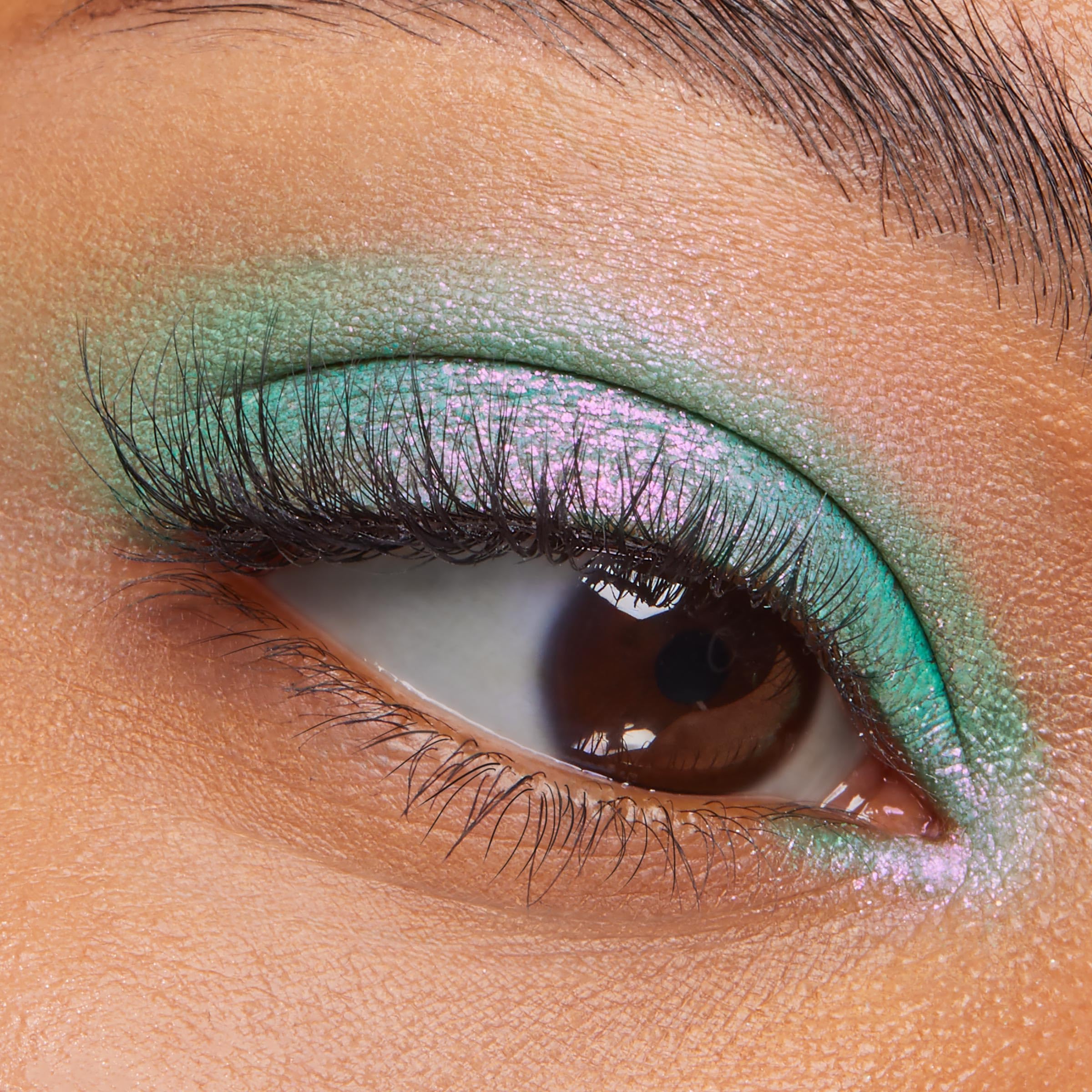 ColourPop Solar Beam applied on eyelid swatch showing vibrant sparkle payoff
