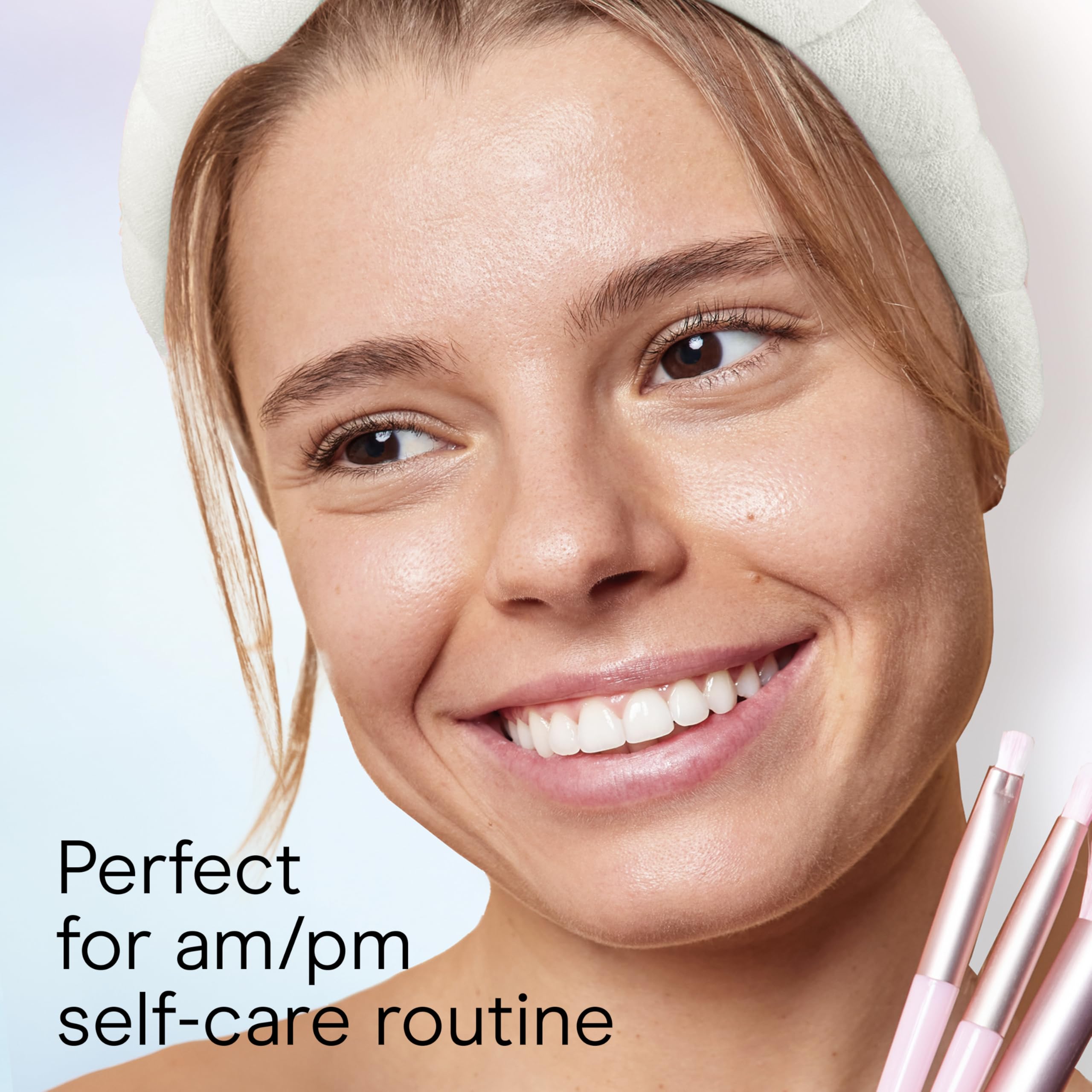 Conair headband in use while washing face prevents hair from getting wet