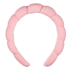 Conair front view of pink headband showing rounded shape and styling benefit