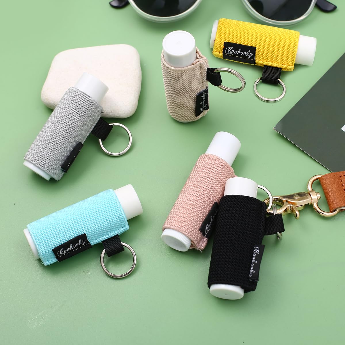 COOKOOKY keychain clipped to backpack loop showing hands-free carry benefit