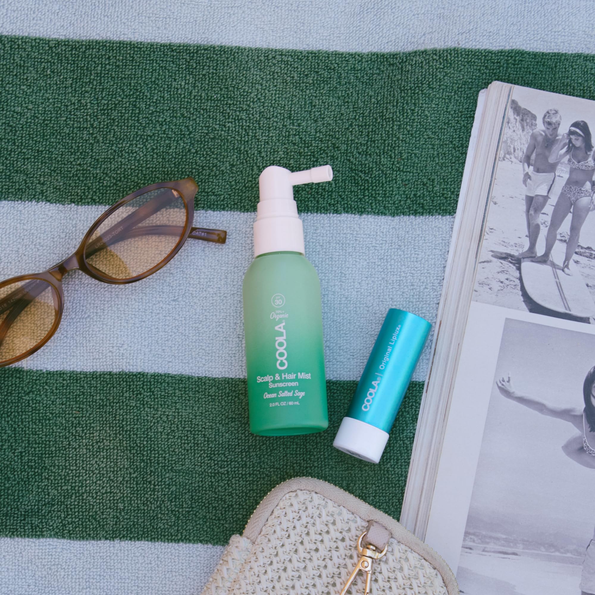 COOLA bottle shown in hand to display compact 2 fl oz size benefit
