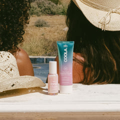 COOLA body melt on skin showing dewy illuminated finish and soft hydration