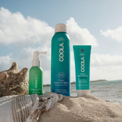 COOLA in beach setting conveying fresh ocean salted sage scent
