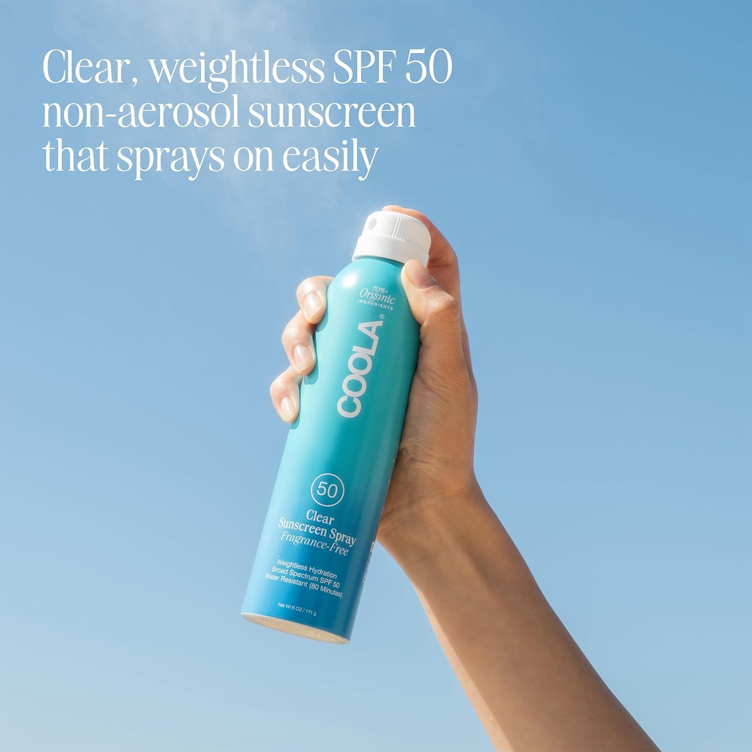 COOLA clear sunscreen spray texture displaying lightweight finish and quick absorption