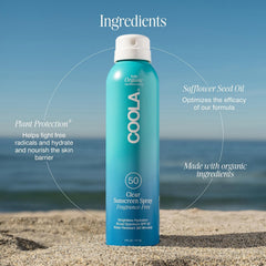 COOLA 6 fl oz bottle next to a hand for accurate size comparison