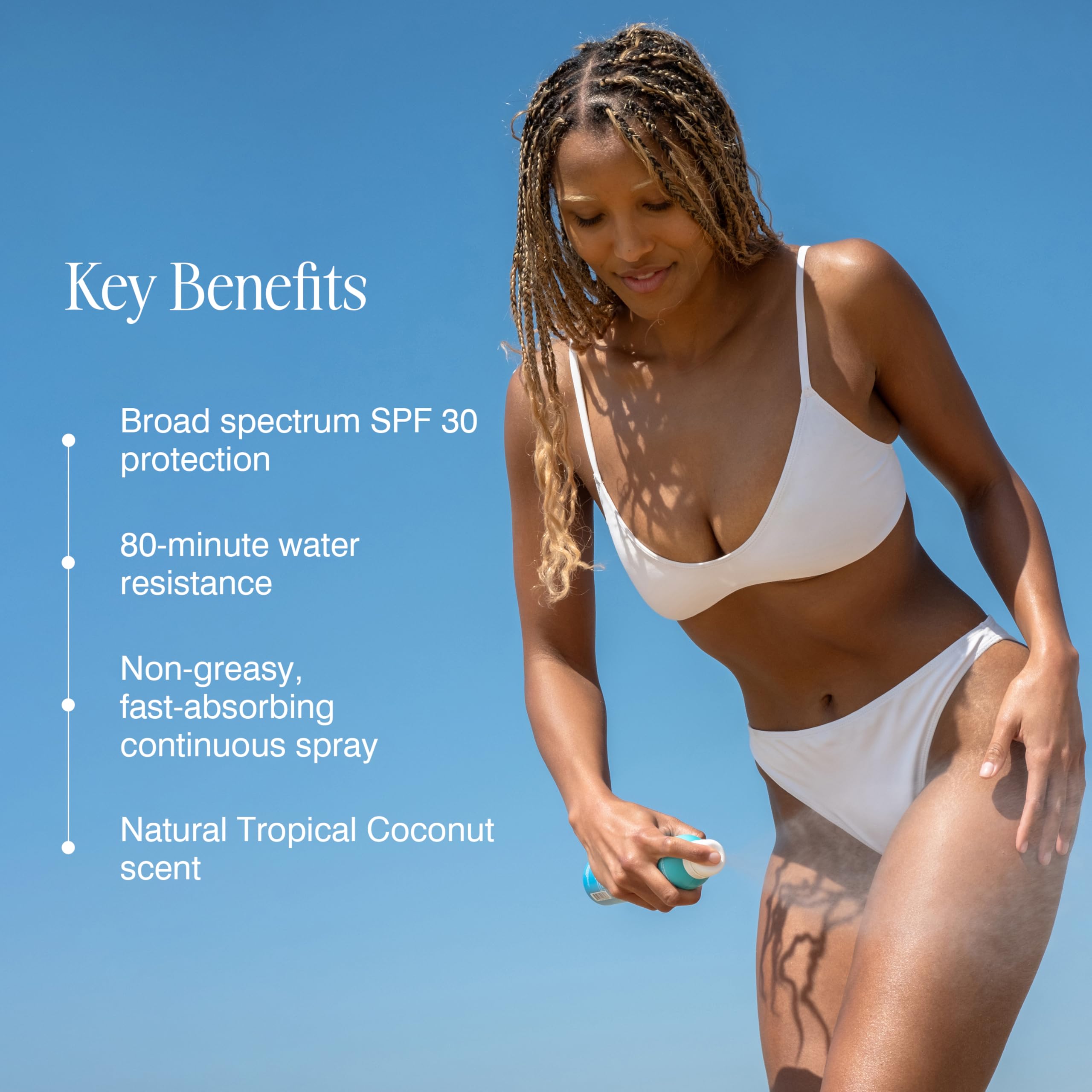 COOLA spray being used upside down to reach back and shoulder areas