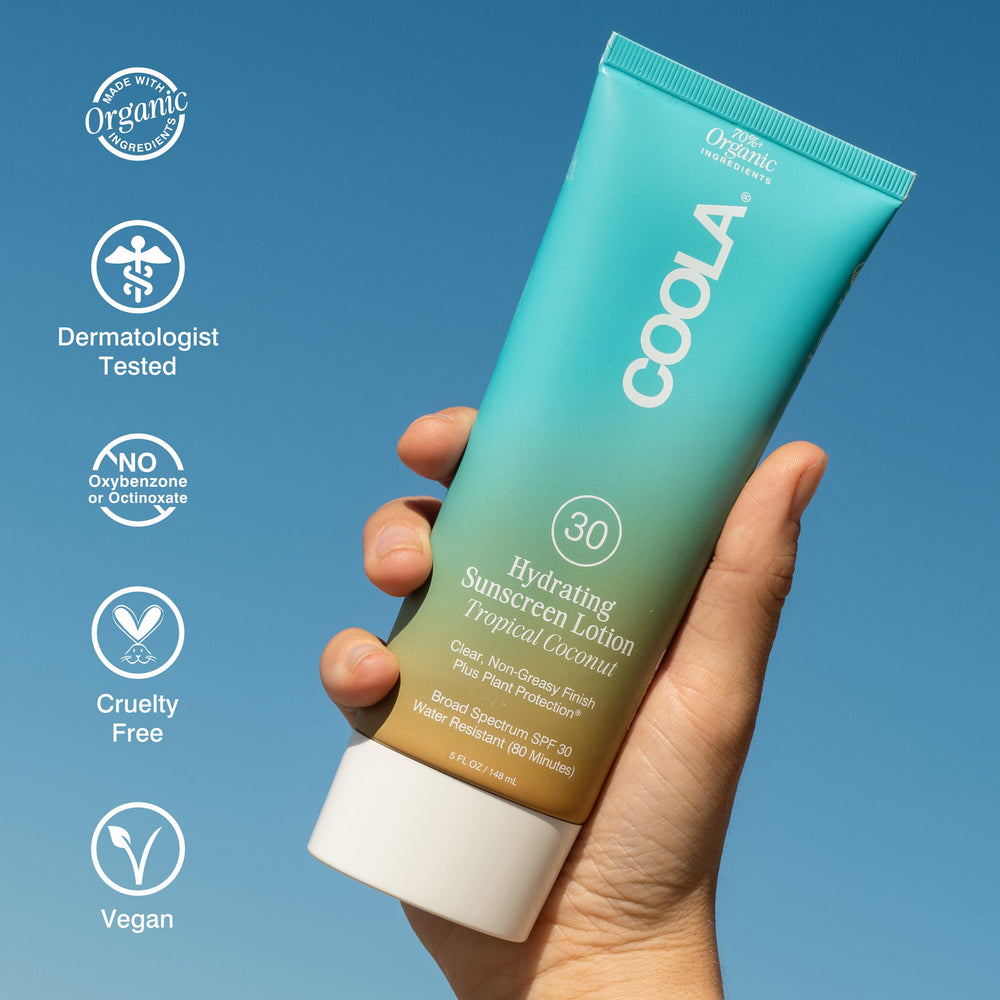 COOLA being smoothed on arm demonstrating even coverage and hydration
