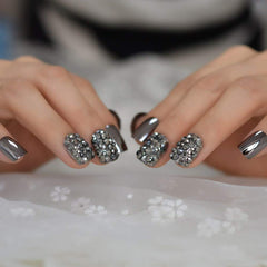 Coolnail tips in hand for scale showing length and fit benefit: accurate size perception