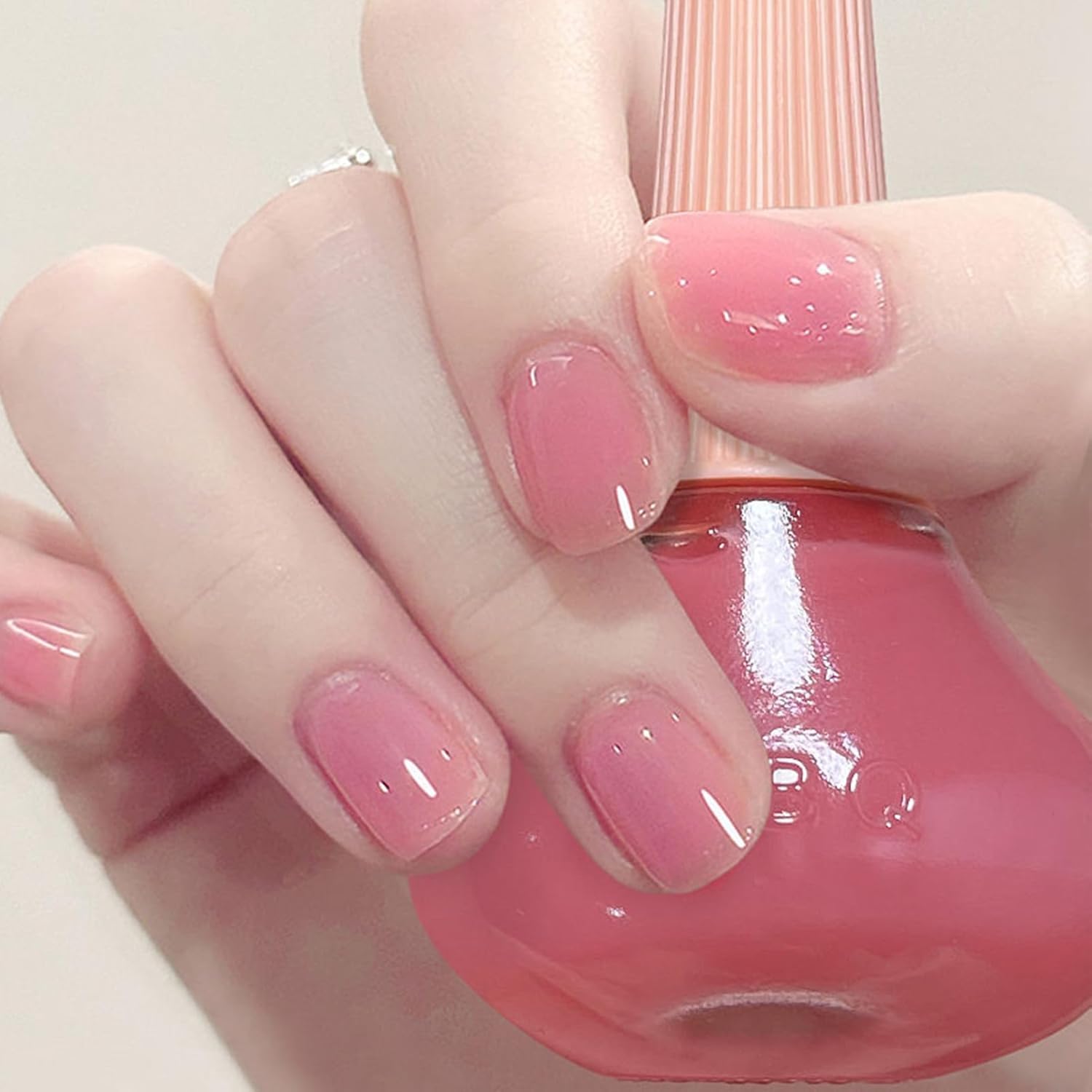 COSMOO bottle front showing peach jelly polish, glossy finish benefit