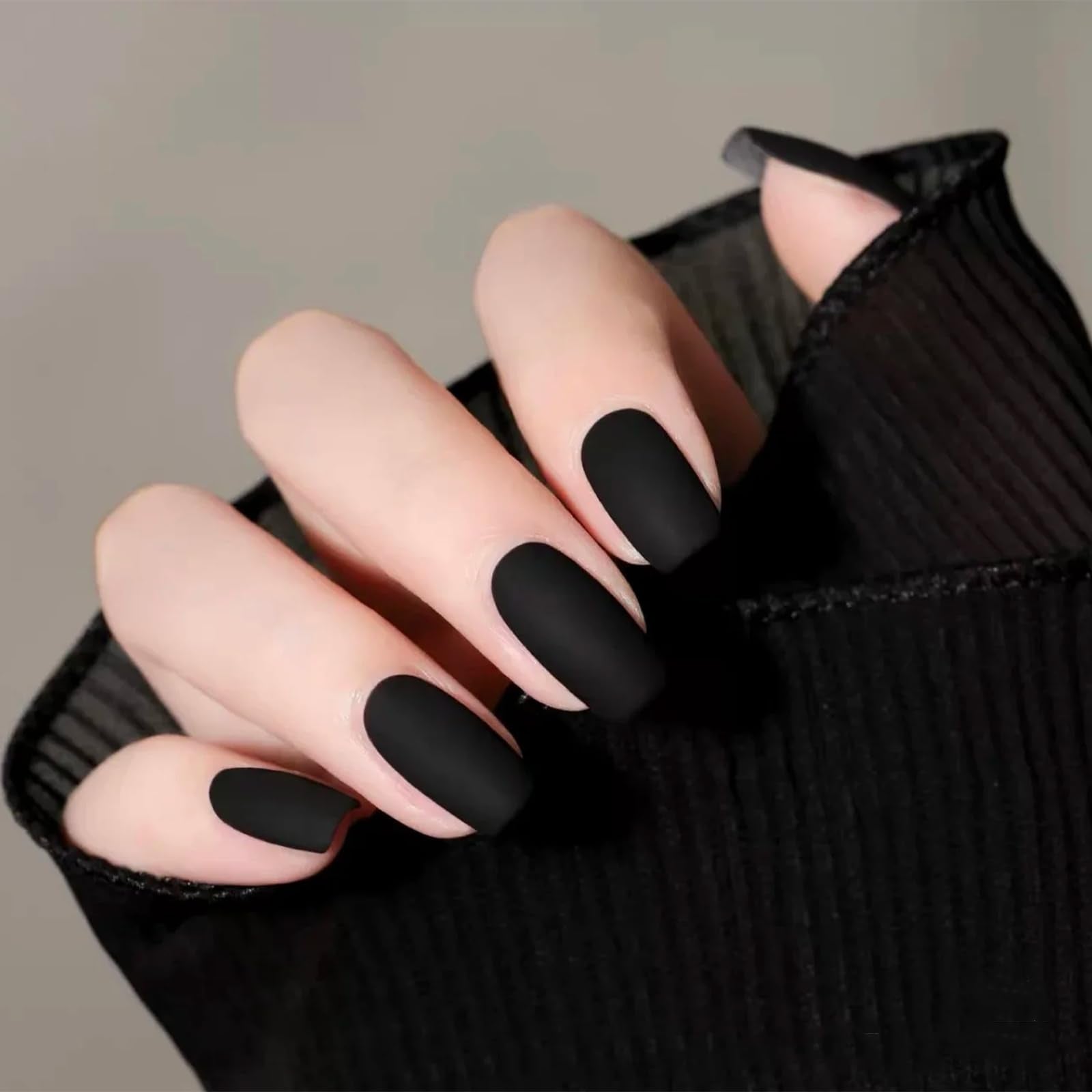 COSMOO front bottle display showing sleek black matte shade and packaging benefit