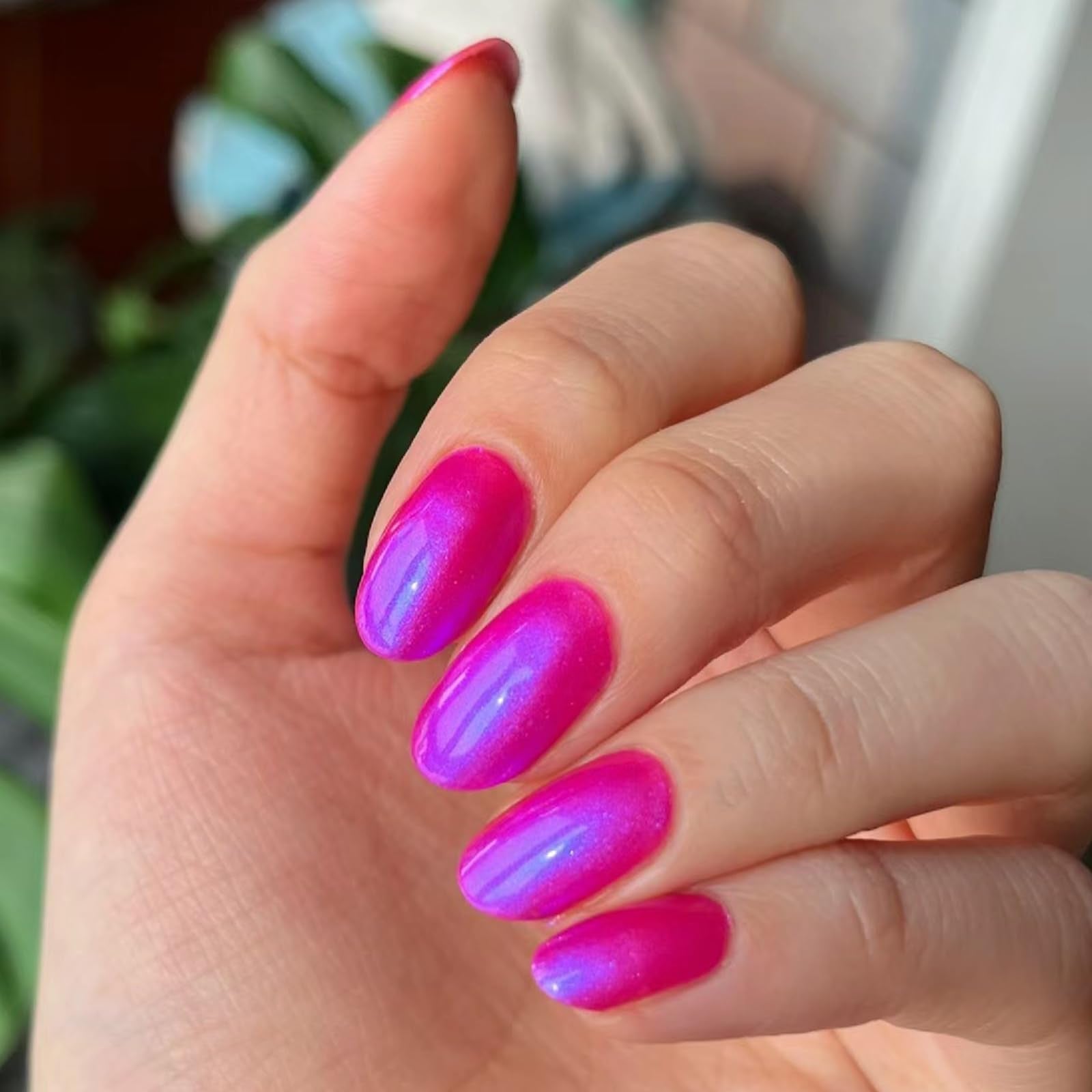 COSMOO brush stroke on white background showing smooth application and vibrant neon-pink payoff