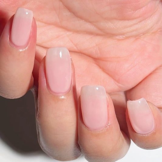 COSMOO bottle front view showing pale pink shade and benefits