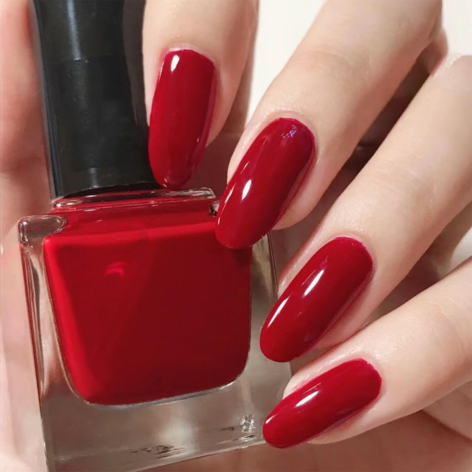 COSMOO red bottle front showing vibrant shade and glossy finish