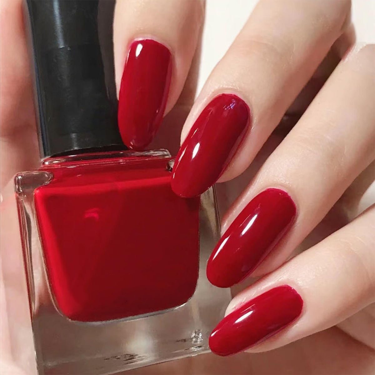 COSMOO red bottle front showing vibrant shade and glossy finish