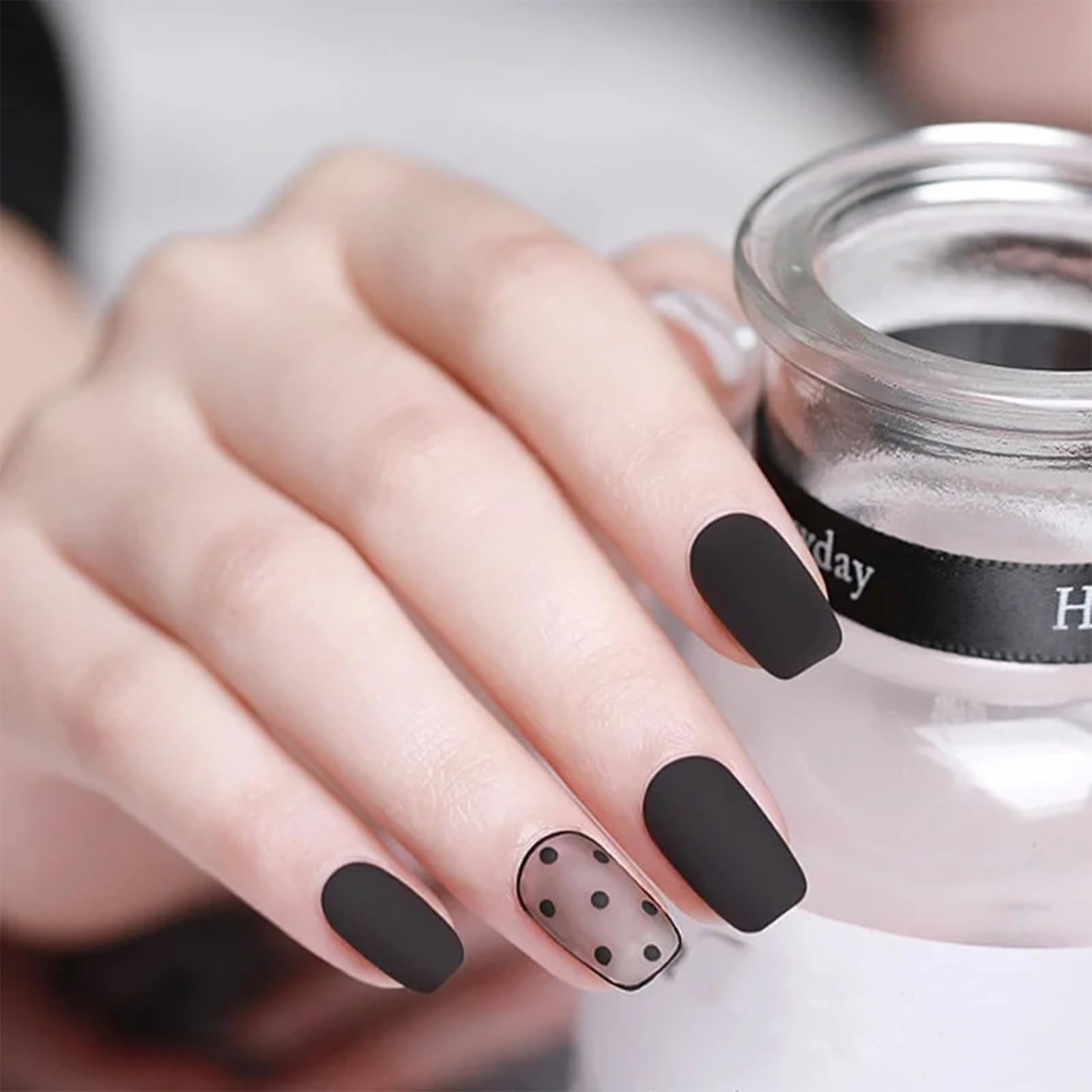COSMOO swatch on nails demonstrating opaque black pigment and neat finish benefit