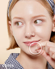 COSRX single 12mm patch on fingertip demonstrating easy application and portability