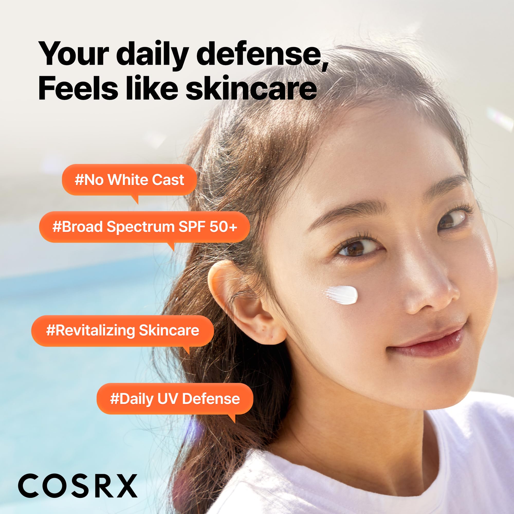 COSRX sunscreen held in hand for scale showing compact travel size benefit