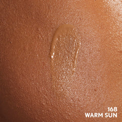 COVERGIRL swatches on forearm displaying Warm Sun shade and buildable coverage options