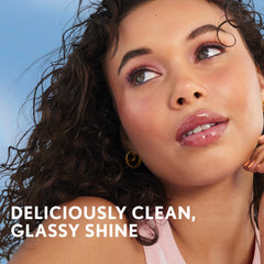 COVERGIRL lifestyle shot of woman wearing gloss showing natural luminous smile benefit